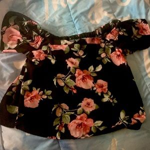 This is a floral shirt from Charlotte Russe that is size medium.